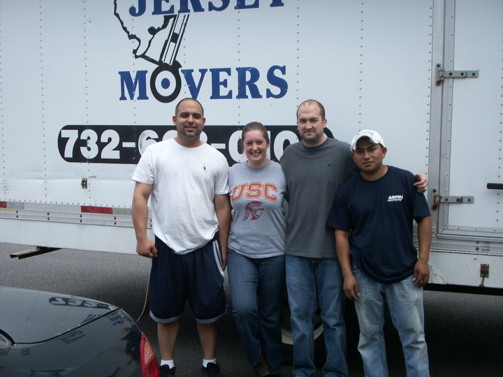 The client is standing with a couple of men from All Jersey Movers
