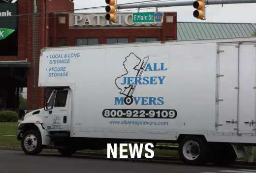 White truck of All Jersey Moving and Storage on the street