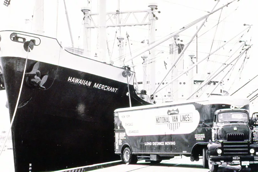 A ship named HAWAIIAN MARCHANT and a big container truck from National Van Lines