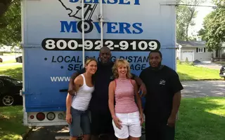The client is standing with a couple of men from All Jersey Movers
